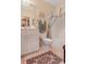 Classic bathroom features a vanity, toilet, and shower-tub combination with patterned rug at 1213 Waterfront Dr, Mount Pleasant, SC 29464