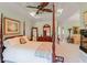 Comfortable bedroom with four-poster bed and seating area at 1213 Waterfront Dr, Mount Pleasant, SC 29464