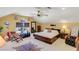 Spacious bedroom features a ceiling fan, a dark wood sleigh bed, and an accent zebra rug at 1213 Waterfront Dr, Mount Pleasant, SC 29464