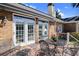 Brick house featuring a deck with iron table set and double french doors for seamless indoor/outdoor living at 1213 Waterfront Dr, Mount Pleasant, SC 29464