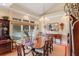 Formal dining room with a chandelier, large window, and elegant furnishings at 1213 Waterfront Dr, Mount Pleasant, SC 29464