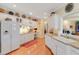 Well-lit kitchen with white cabinetry, hardwood floors, and plenty of storage space at 1213 Waterfront Dr, Mount Pleasant, SC 29464