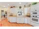 Bright kitchen featuring white cabinets, ample countertop space, and modern appliances at 1213 Waterfront Dr, Mount Pleasant, SC 29464