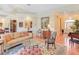 Spacious living room showcasing a hardwood floor, comfortable seating, and elegant decor at 1213 Waterfront Dr, Mount Pleasant, SC 29464