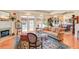 Elegant living room with a fireplace, large windows, and stylish furnishings at 1213 Waterfront Dr, Mount Pleasant, SC 29464