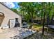 Backyard features a patio with a table and chairs, a grill, and a storage shed at 1257 Maryland Dr, Ladson, SC 29456