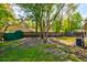 Spacious backyard featuring a privacy fence, storage shed, play equipment and an air conditioning unit at 1257 Maryland Dr, Ladson, SC 29456