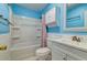 Bathroom showcasing blue walls, a shower-tub combo with a patterned curtain, and white vanity at 1257 Maryland Dr, Ladson, SC 29456