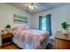 Cozy bedroom with light walls, wood floors, and a ceiling fan at 1257 Maryland Dr, Ladson, SC 29456