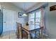 Bright dining area featuring a rustic wooden table and modern lighting fixture at 1257 Maryland Dr, Ladson, SC 29456
