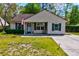 Well-kept single-story home with a tidy front lawn and concrete walkway at 1257 Maryland Dr, Ladson, SC 29456