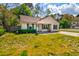 Cozy single-story home with tidy lawn and mature trees at 1257 Maryland Dr, Ladson, SC 29456