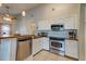 Bright kitchen features stainless steel appliances, white cabinets, and wooden countertops at 1257 Maryland Dr, Ladson, SC 29456