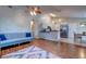 Open concept living room with sofa, and view of the kitchen with stainless steel appliances at 1257 Maryland Dr, Ladson, SC 29456