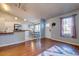 Well-lit living room with a view of a breakfast nook and a stylish front door at 1257 Maryland Dr, Ladson, SC 29456