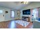 Comfortable living room with built-in shelving, electric fireplace, and hardwood flooring at 1257 Maryland Dr, Ladson, SC 29456