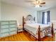 Comfortable main bedroom with wood floors, ceiling fan, dresser, side table, and large bed at 1257 Maryland Dr, Ladson, SC 29456