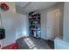 The storage room features two doors, storage racks, and gray tile flooring at 1257 Maryland Dr, Ladson, SC 29456