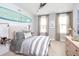 Cozy bedroom with surf board, ceiling fan, natural light and surf decor at 136 Maritime Way, Summerville, SC 29485