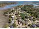 Aerial view of the community showcasing waterfront homes, ponds, and marshland at 1369 Tidal Creek Cv, Charleston, SC 29412