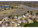 An aerial view showcasing the community near waterways, docks, and marshland at 1369 Tidal Creek Cv, Charleston, SC 29412