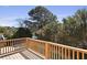 Large back deck overlooking a backyard swimming pool, landscaping, and nearby waterway at 1369 Tidal Creek Cv, Charleston, SC 29412