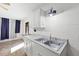 Close up of basement laundry area featuring a stainless sink and window with curtains at 1369 Tidal Creek Cv, Charleston, SC 29412