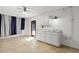 Basement laundry area featuring herringbone floors, white cabinetry, and stainless steel sink at 1369 Tidal Creek Cv, Charleston, SC 29412