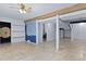 Spacious basement featuring unique barn doors, open shelving and herringbone floors at 1369 Tidal Creek Cv, Charleston, SC 29412
