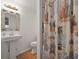 Bathroom with pedestal sink, toilet, fish decorations and a patterned shower curtain at 1369 Tidal Creek Cv, Charleston, SC 29412