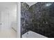 Bathroom featuring a shower with dark marble tiles at 1369 Tidal Creek Cv, Charleston, SC 29412