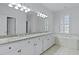 Bright bathroom featuring double sinks, granite counters, and a jetted tub at 1369 Tidal Creek Cv, Charleston, SC 29412