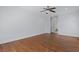 Spacious bedroom with hardwood floors, ceiling fan, and attached bath at 1369 Tidal Creek Cv, Charleston, SC 29412