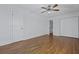 Bedroom with hardwood floors and white walls features a ceiling fan and a closet at 1369 Tidal Creek Cv, Charleston, SC 29412