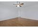 Bedroom with hardwood floors and white walls features a ceiling fan and closet at 1369 Tidal Creek Cv, Charleston, SC 29412