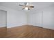 Bedroom with hardwood floors and white walls features a ceiling fan and closet at 1369 Tidal Creek Cv, Charleston, SC 29412