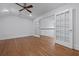 Expansive bonus room features hardwood flooring and elegant french doors leading to another level at 1369 Tidal Creek Cv, Charleston, SC 29412