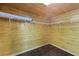 Walk in closet with wooden floor and wooden panels and white shelving at 1369 Tidal Creek Cv, Charleston, SC 29412