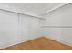 Walk-in closet with wood flooring and metal storage bars for hanging clothing at 1369 Tidal Creek Cv, Charleston, SC 29412