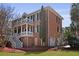 Beautiful brick home with dual front porches, black shutters, a side-entry garage, and well-maintained landscaping at 1369 Tidal Creek Cv, Charleston, SC 29412