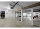 Spacious garage with overhead lighting, support beams and ample storage at 1369 Tidal Creek Cv, Charleston, SC 29412