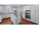 Modern kitchen with granite countertops, stainless steel appliances, and hardwood flooring at 1369 Tidal Creek Cv, Charleston, SC 29412