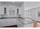 Kitchen featuring a center island with granite countertop and views of the living area at 1369 Tidal Creek Cv, Charleston, SC 29412