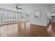 Light-filled living room featuring hardwood flooring and a large window offering plenty of natural light at 1369 Tidal Creek Cv, Charleston, SC 29412