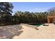 Beautiful backyard pool area with travertine tile and lush landscaping offering privacy at 1369 Tidal Creek Cv, Charleston, SC 29412