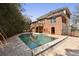 Gorgeous in-ground pool and patio area with lush landscaping and brick home exterior at 1369 Tidal Creek Cv, Charleston, SC 29412