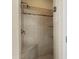 Walk-in shower with seat, tiled walls, and glass door at 1369 Tidal Creek Cv, Charleston, SC 29412