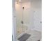 Modern bathroom with glass shower, white subway tile, and marble floors at 149 Greenbelt Ct, Summerville, SC 29485