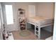 Bedroom with loft bed, bookcase, and a door that leads to the outside at 149 Greenbelt Ct, Summerville, SC 29485