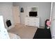 Well-lit bedroom with a dresser, television, and neutral carpet at 149 Greenbelt Ct, Summerville, SC 29485